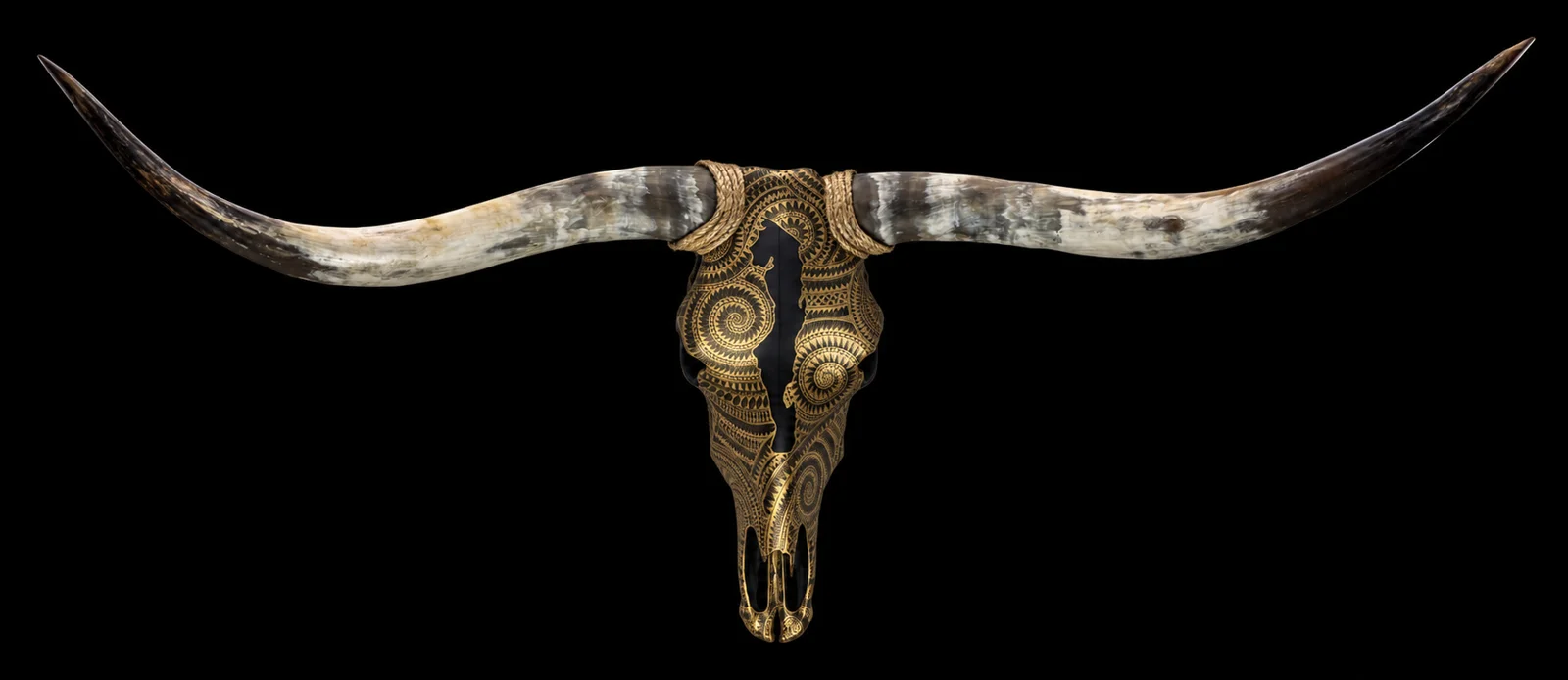 Traditional collection: a sculptural skull with sweeping natural horns and intricate gold ornament