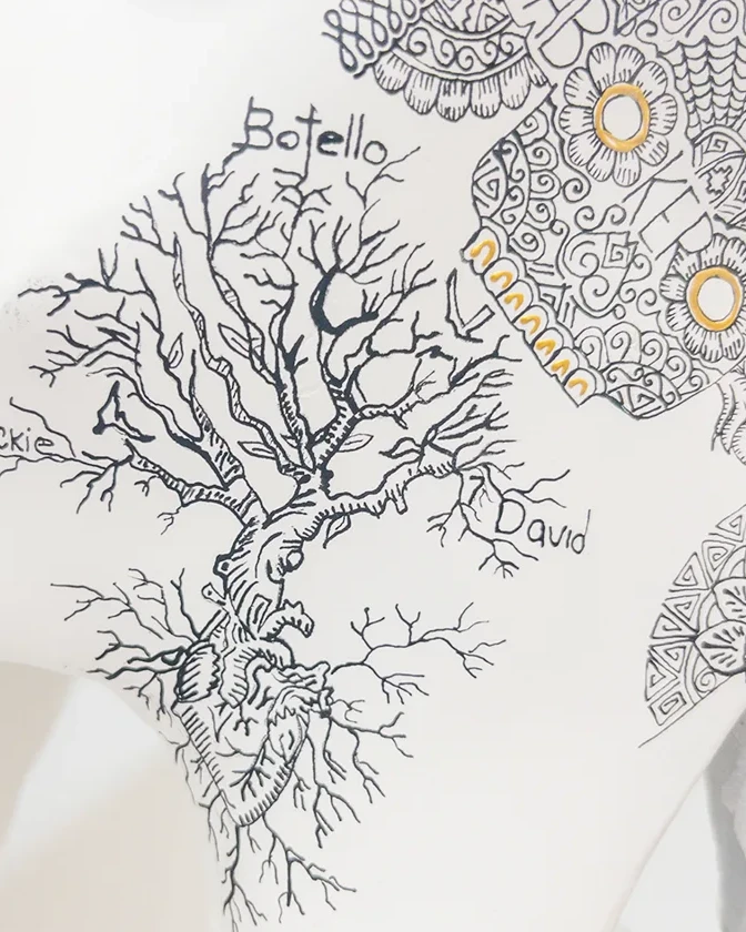Close view of a tree motif on a white commissioned piece