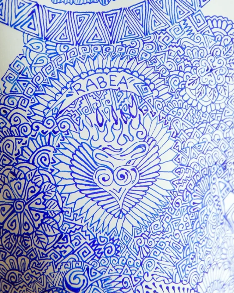 A heart motif with lettering surrounded by dense blue patterns