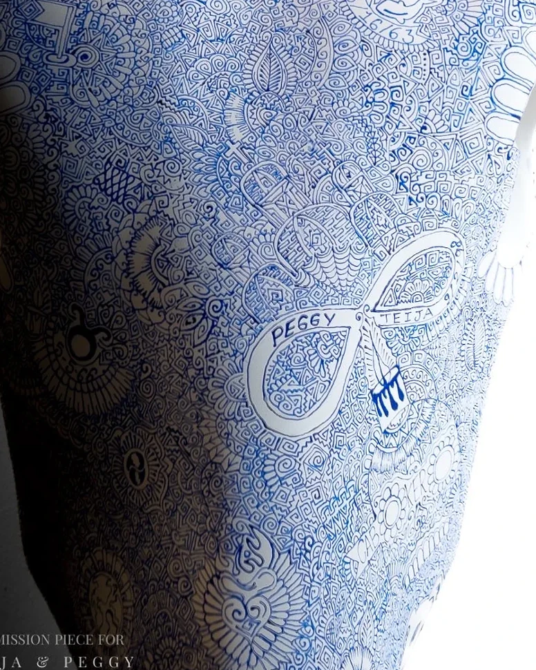 An infinity-shaped motif integrated into blue fine linework