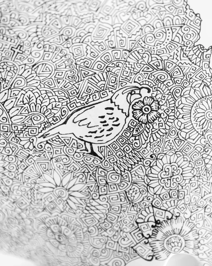A bird illustration surrounded by circular and geometric black linework on white