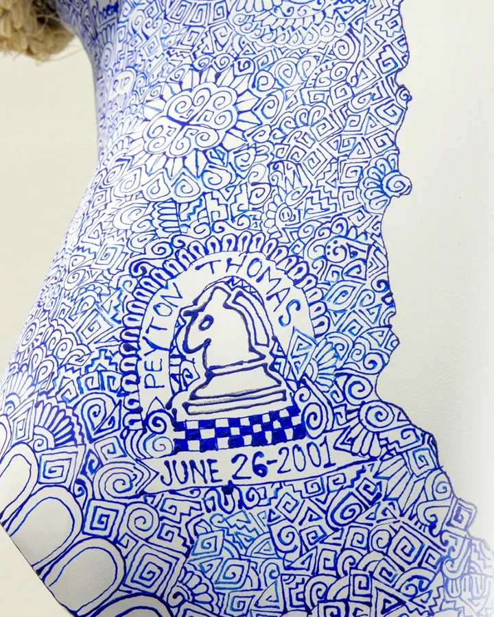 Blue hand-drawn symbols on a white Cabokero commission