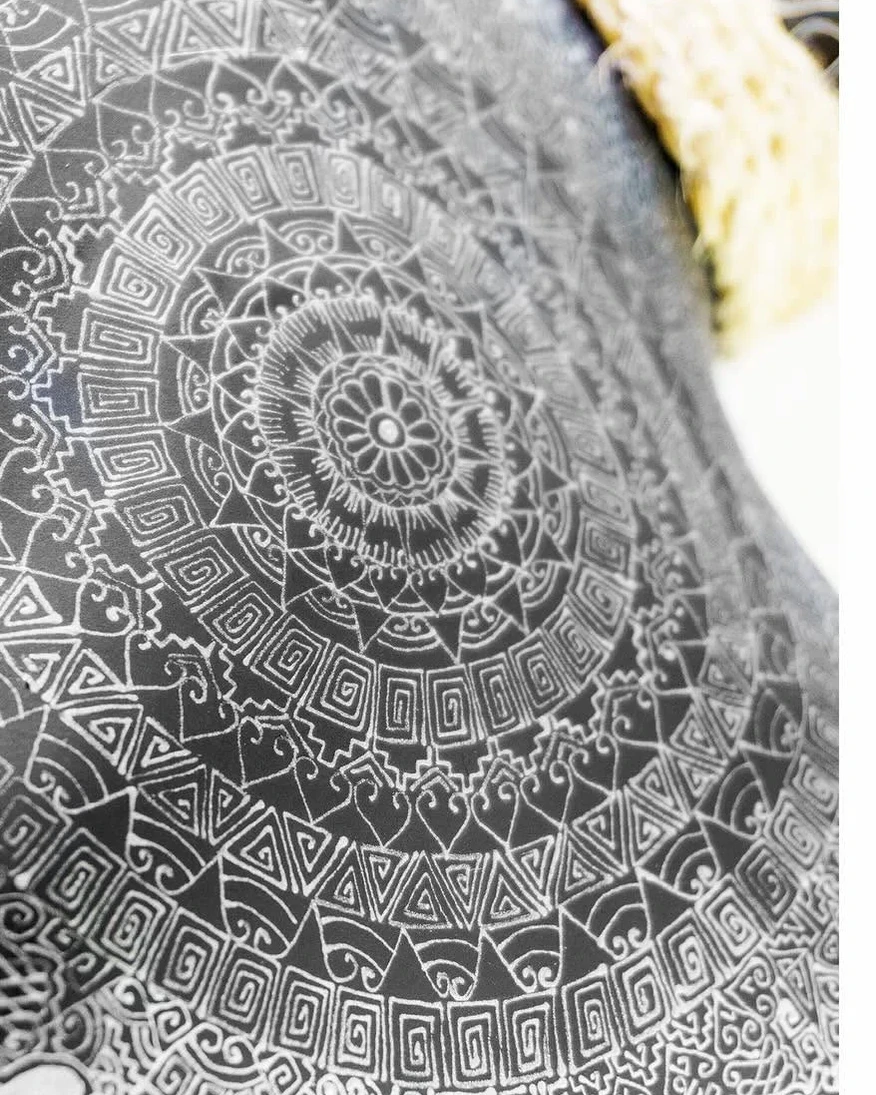 Silver circular patterns on a black Cabokero commission