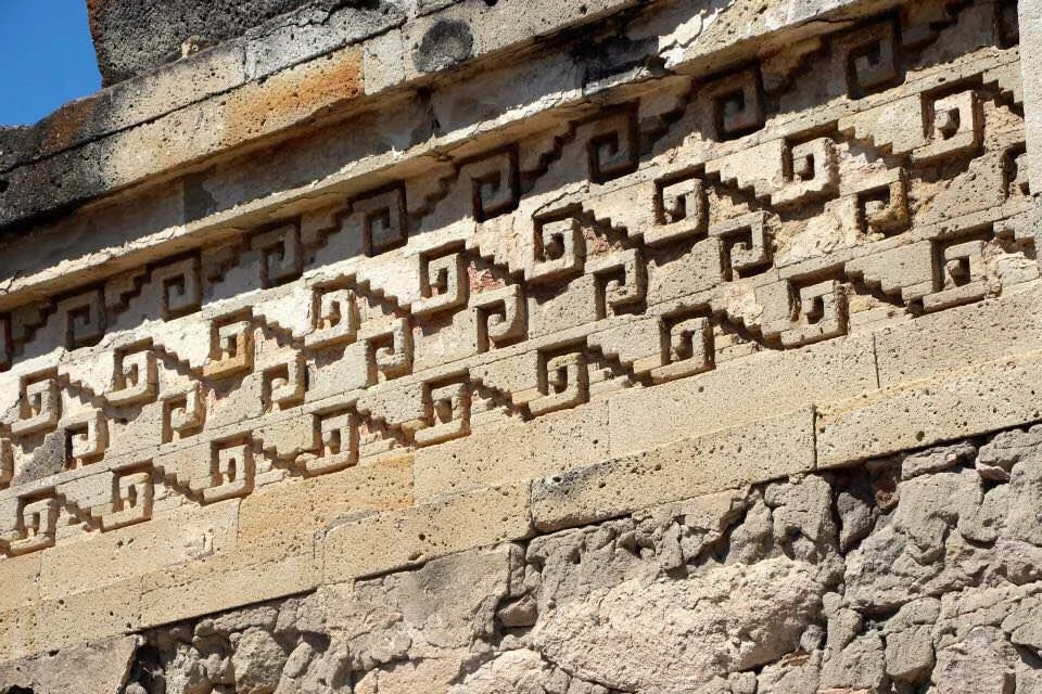 Stepped frets and angular spirals repeated in the stone mosaics of Mitla